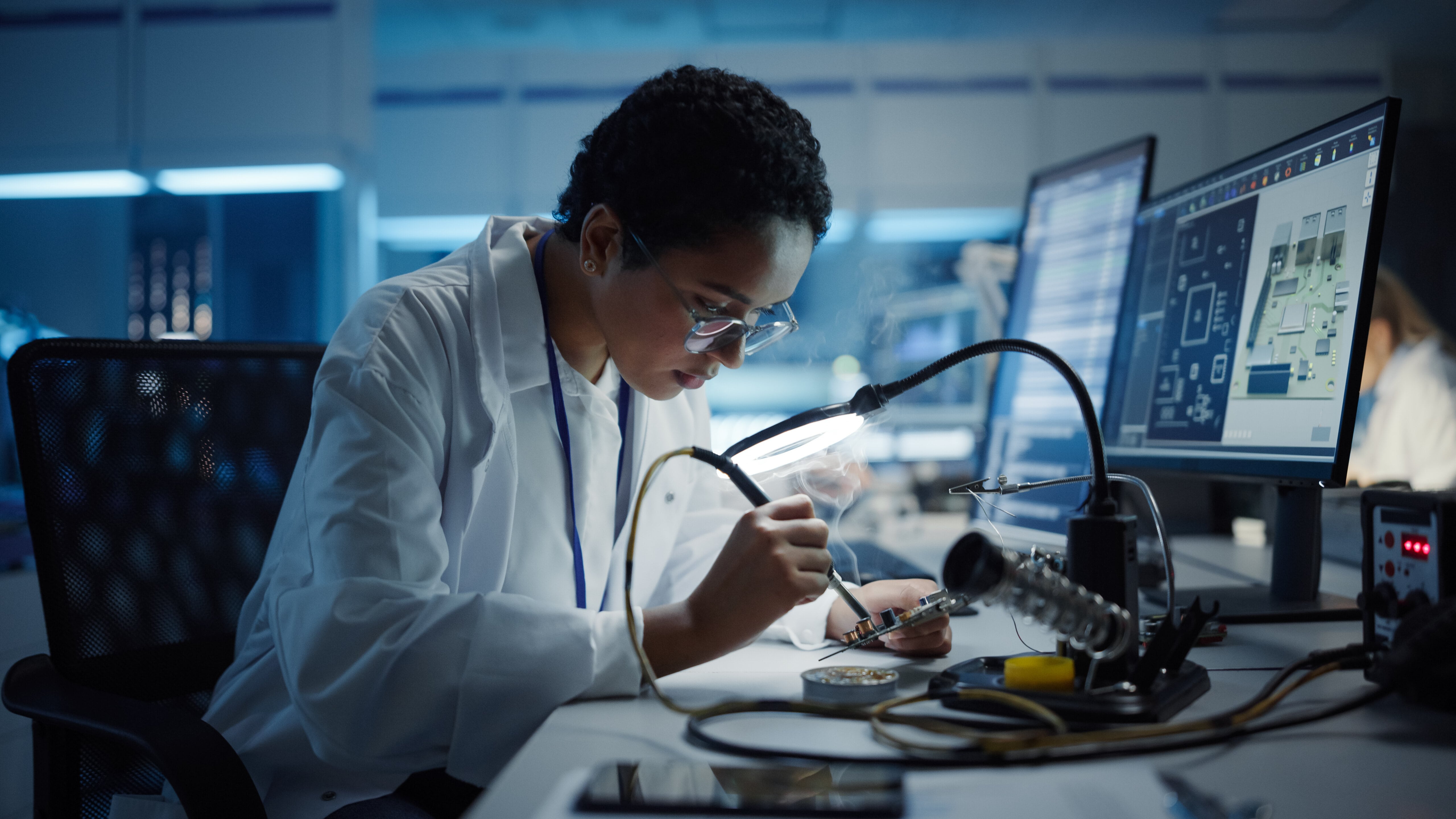 Black Female Engineer Does Computer Motherboard Soldering. Scientists Design PCB, Silicon Microchips, Semiconductors